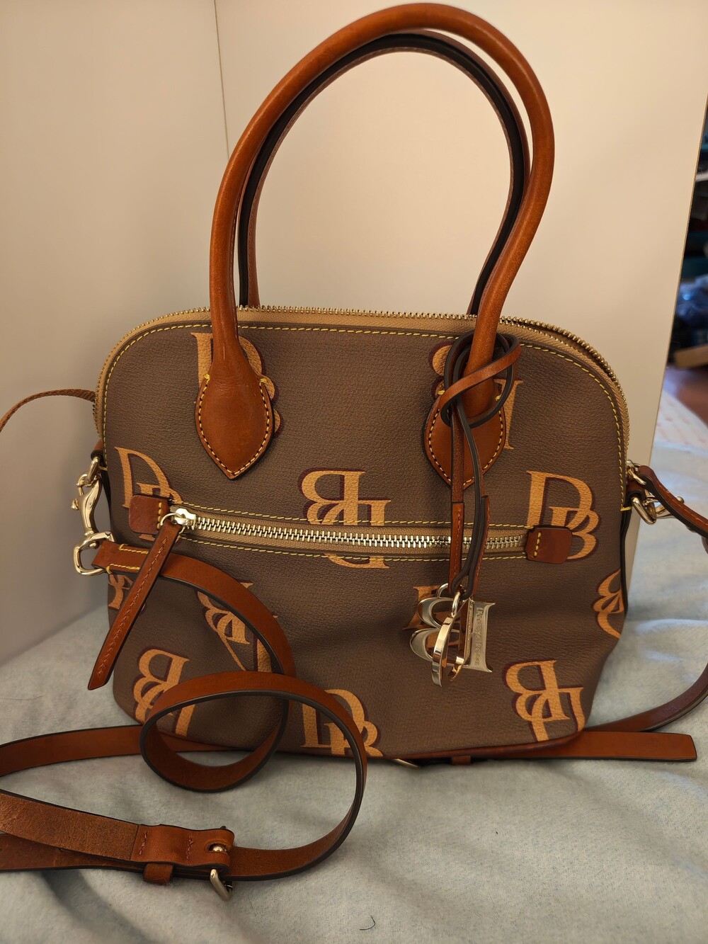 Dooney & Bourke Brown Pebbled Leather Handbag with DB Logo Pattern